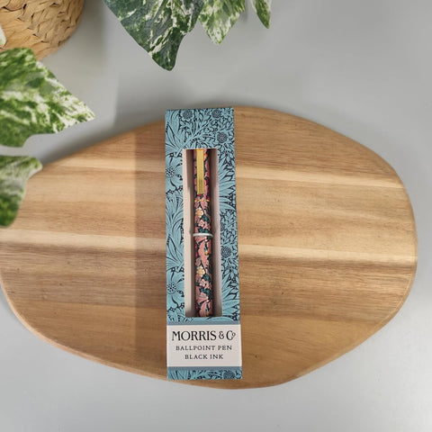 Morris & Co ballpoint pen set in packaging on a wooden surface with plants in the background