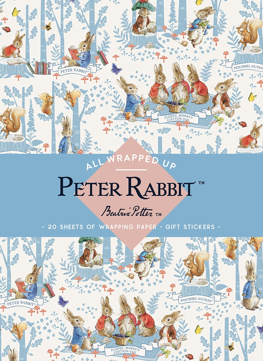 Peter Rabbit wrapping paper set with illustrations of rabbits in a forest setting.