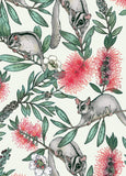 A repeating illustrated pattern featuring gray sugar gliders clinging to branches with green leaves and bright red bottle-blossom flowers on a light cream background.