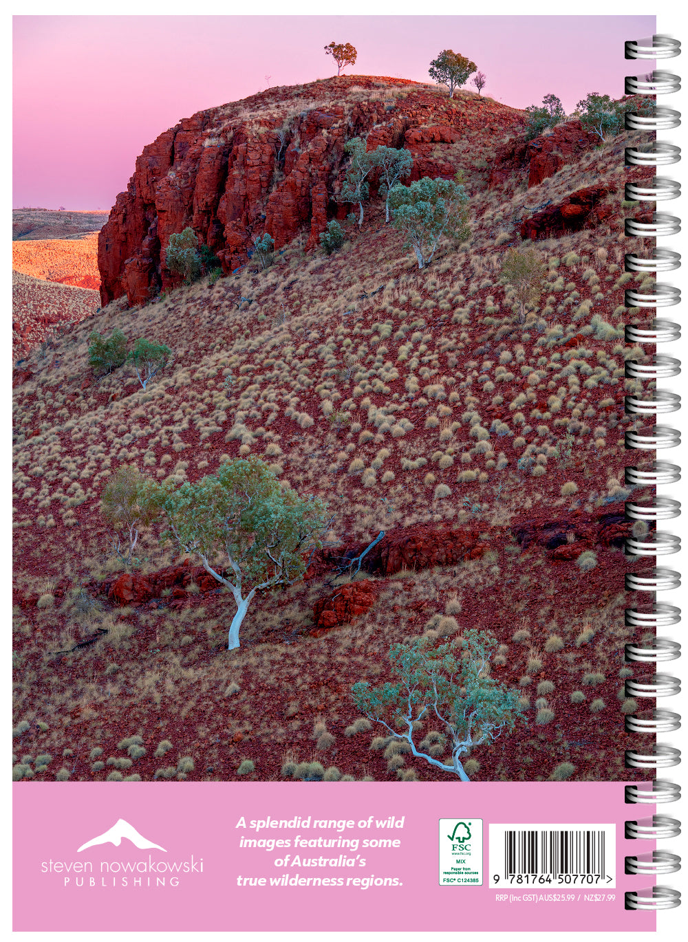 Notebook with a scenic cover of a desert landscape and trees, featuring the publisher's logo.