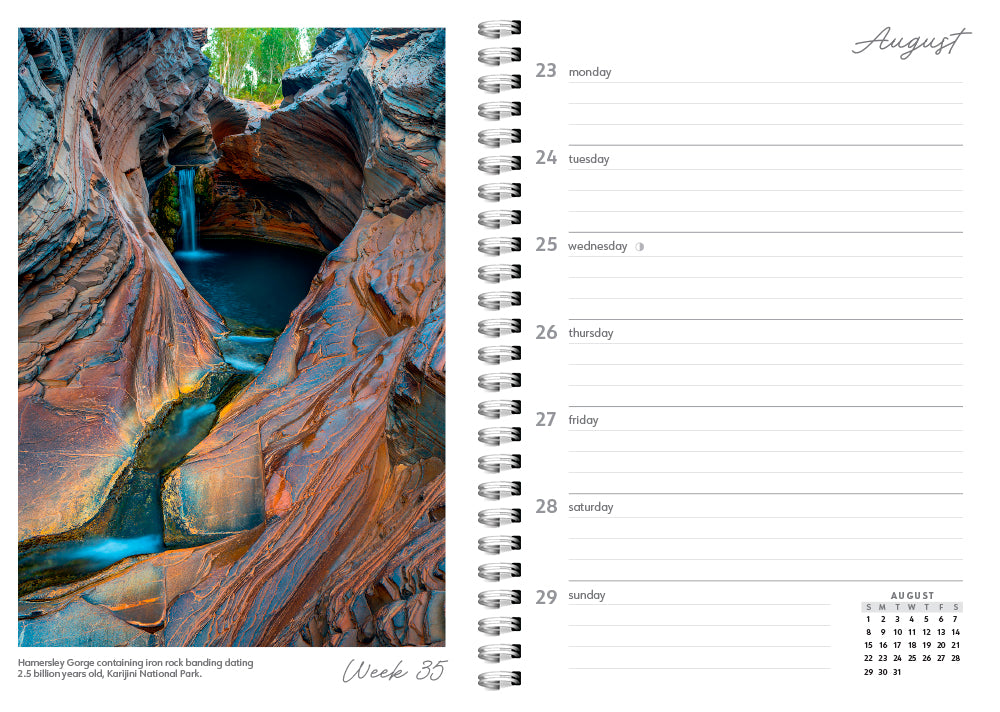 Calendar page with a rock formation and water feature on one side and a grid layout on the other.