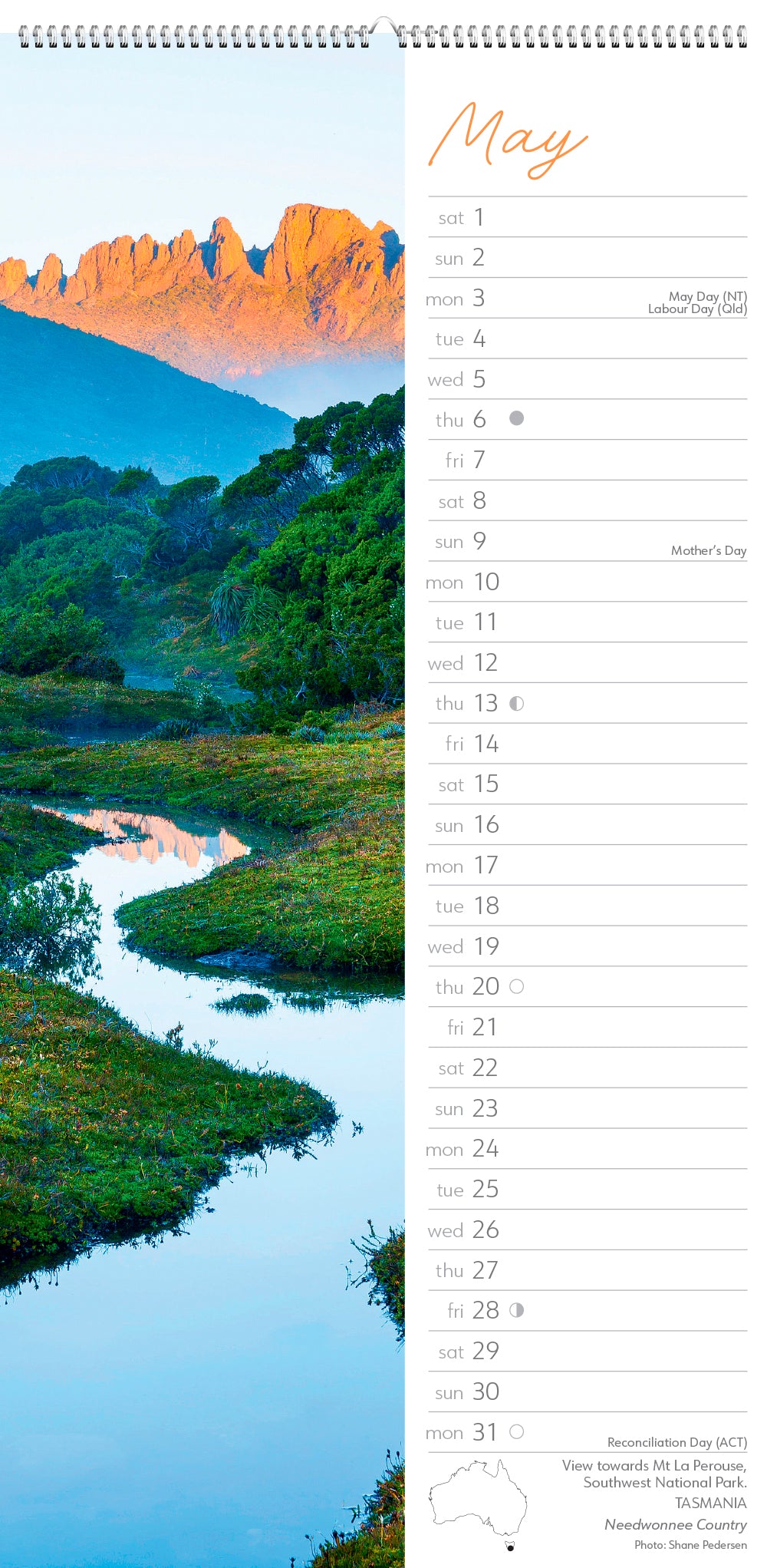 Calendar page for May showing a scenic landscape with a river and mountains.