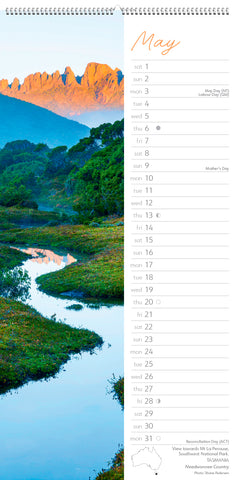 Calendar page for May showing a scenic landscape with a river and mountains.