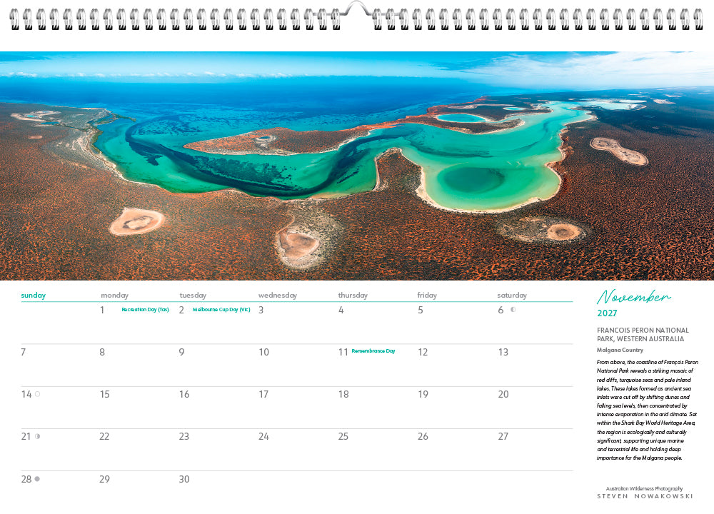 November calendar page with an aerial photo of a coastline with green blue water and scrub