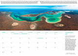 November calendar page with an aerial photo of a coastline with green blue water and scrub