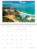 May page of calendar with an image of a coastline with surf and big rocks.