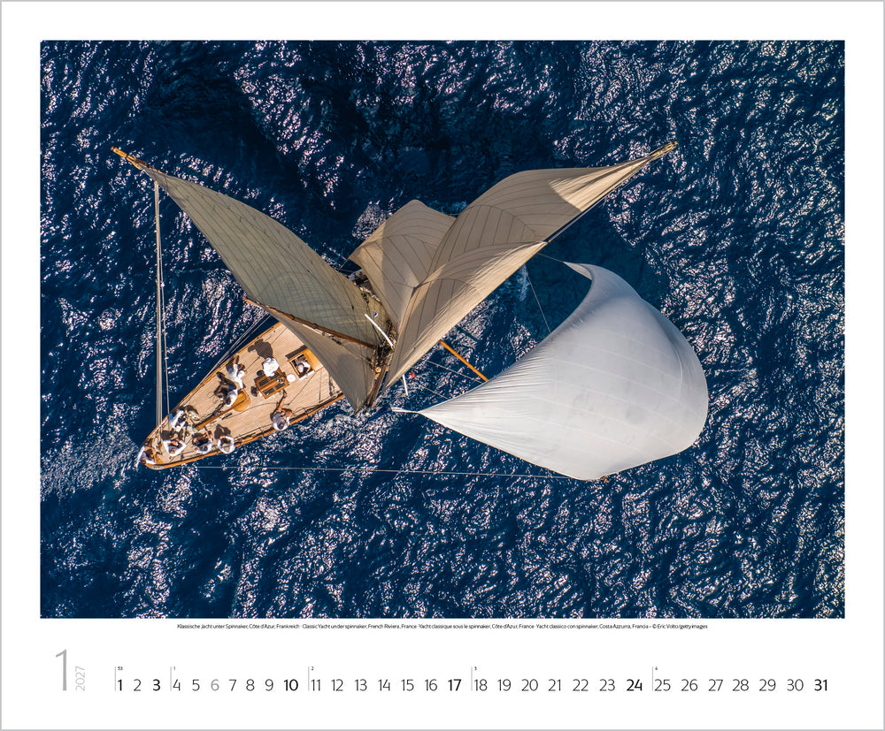 A view of a sailing boat from above on the water