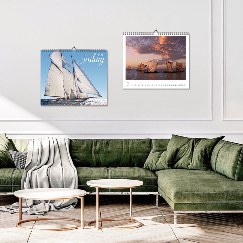 A smart room with 2 sailing calendars hanging on the wall