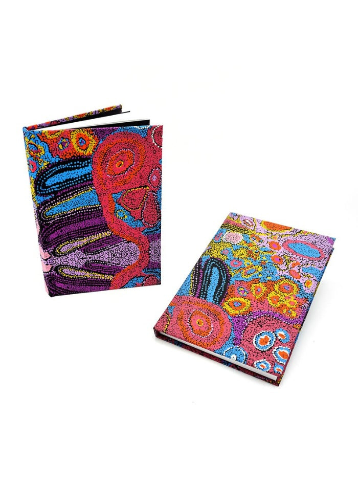 A brightly coloured handmade notebook from Better World Arts with artwork by Andrea Mimpitja Adamson.