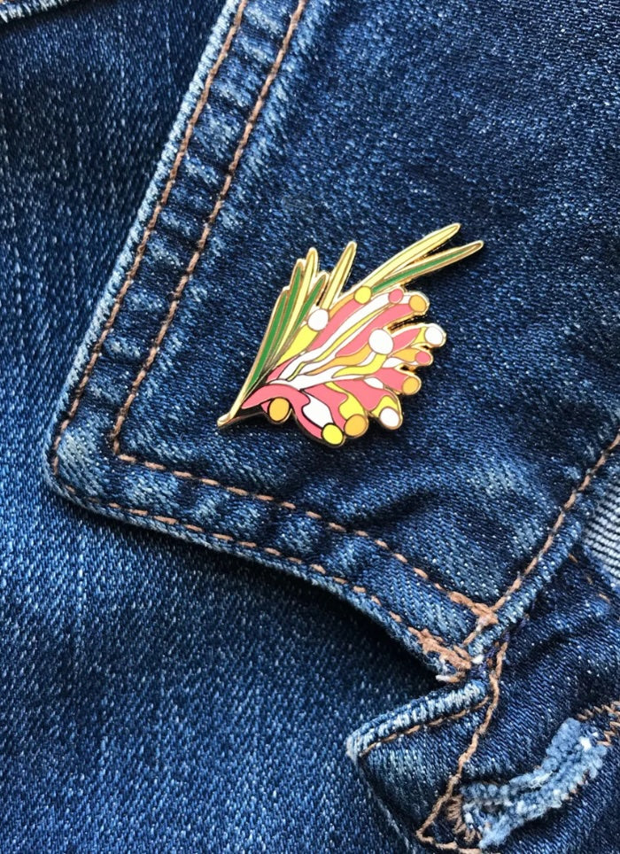 Floral pin on a blue denim jacket