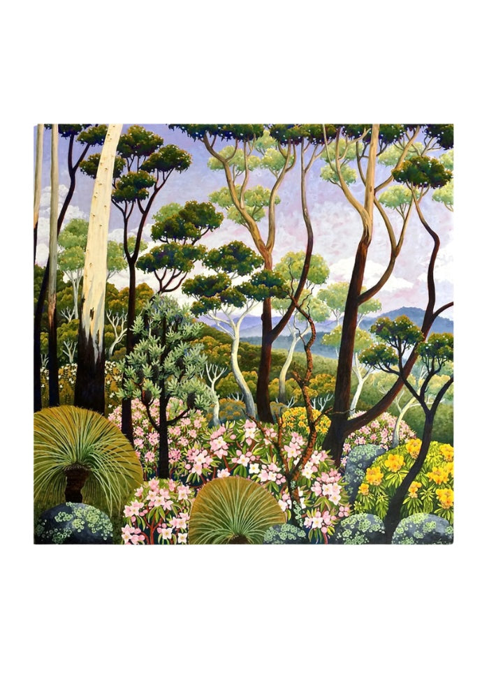 A square card with green trees and flowering bushes with mountains in the background
