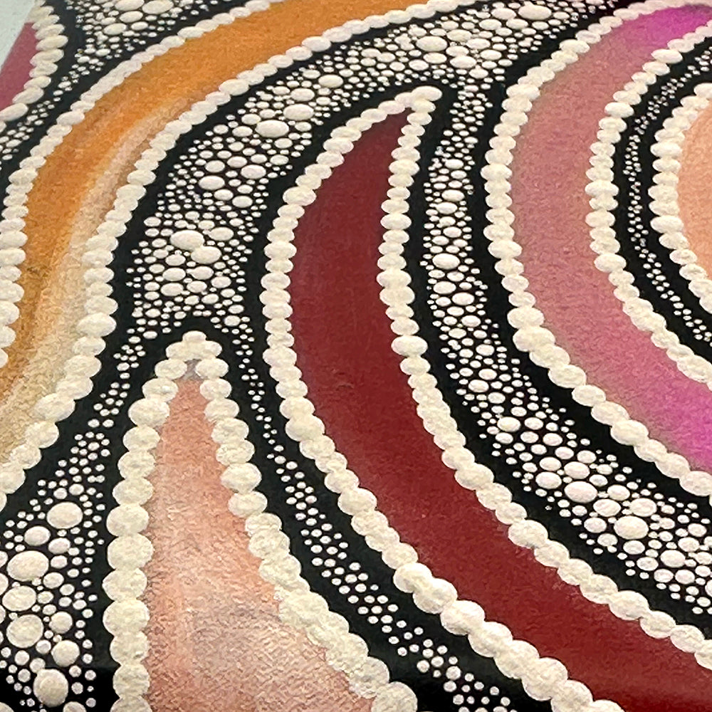 A close-up of a colorful abstract artwork featuring concentric curved bands in orange, pink, burgundy, and purple, outlined with white dotted patterns on a black background.