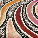 A close-up of a colorful abstract artwork featuring concentric curved bands in orange, pink, burgundy, and purple, outlined with white dotted patterns on a black background.