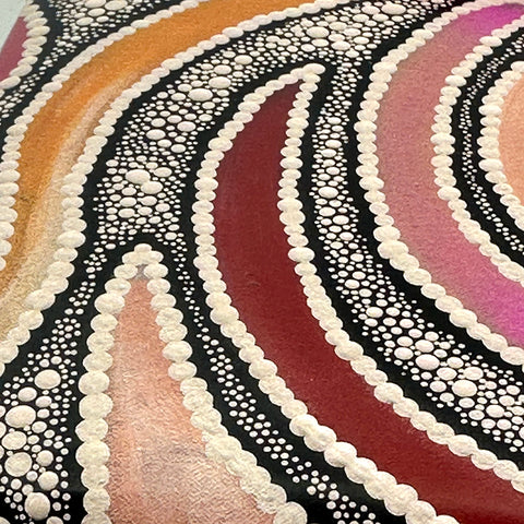 A close-up of a colorful abstract artwork featuring concentric curved bands in orange, pink, burgundy, and purple, outlined with white dotted patterns on a black background.