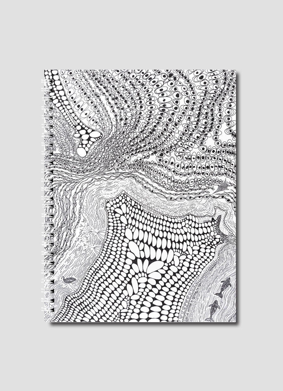 Notebook with black and white abstract pattern on a gray background