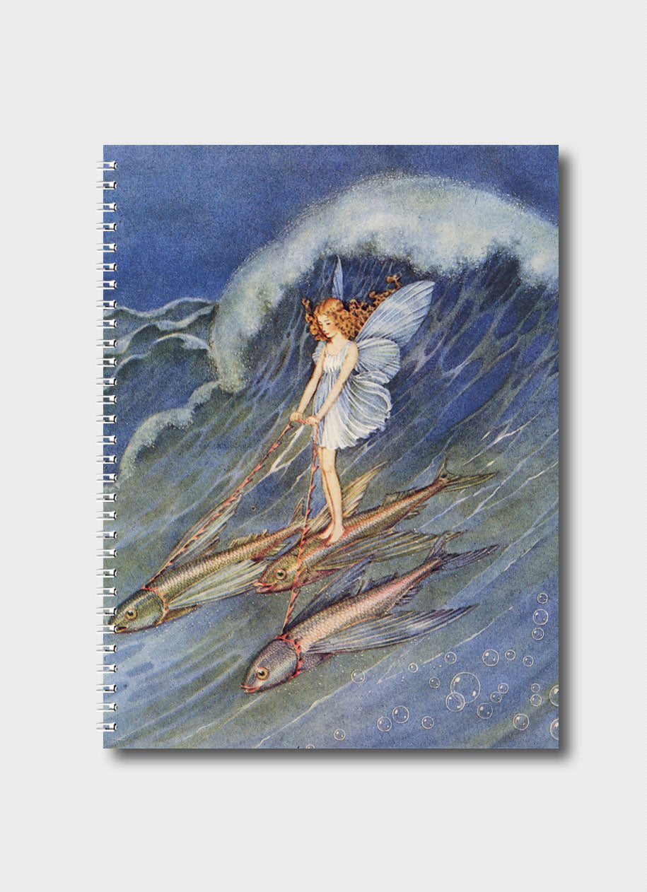 A notebook with a fairy riding 3 fish on a wave in a blue sea.