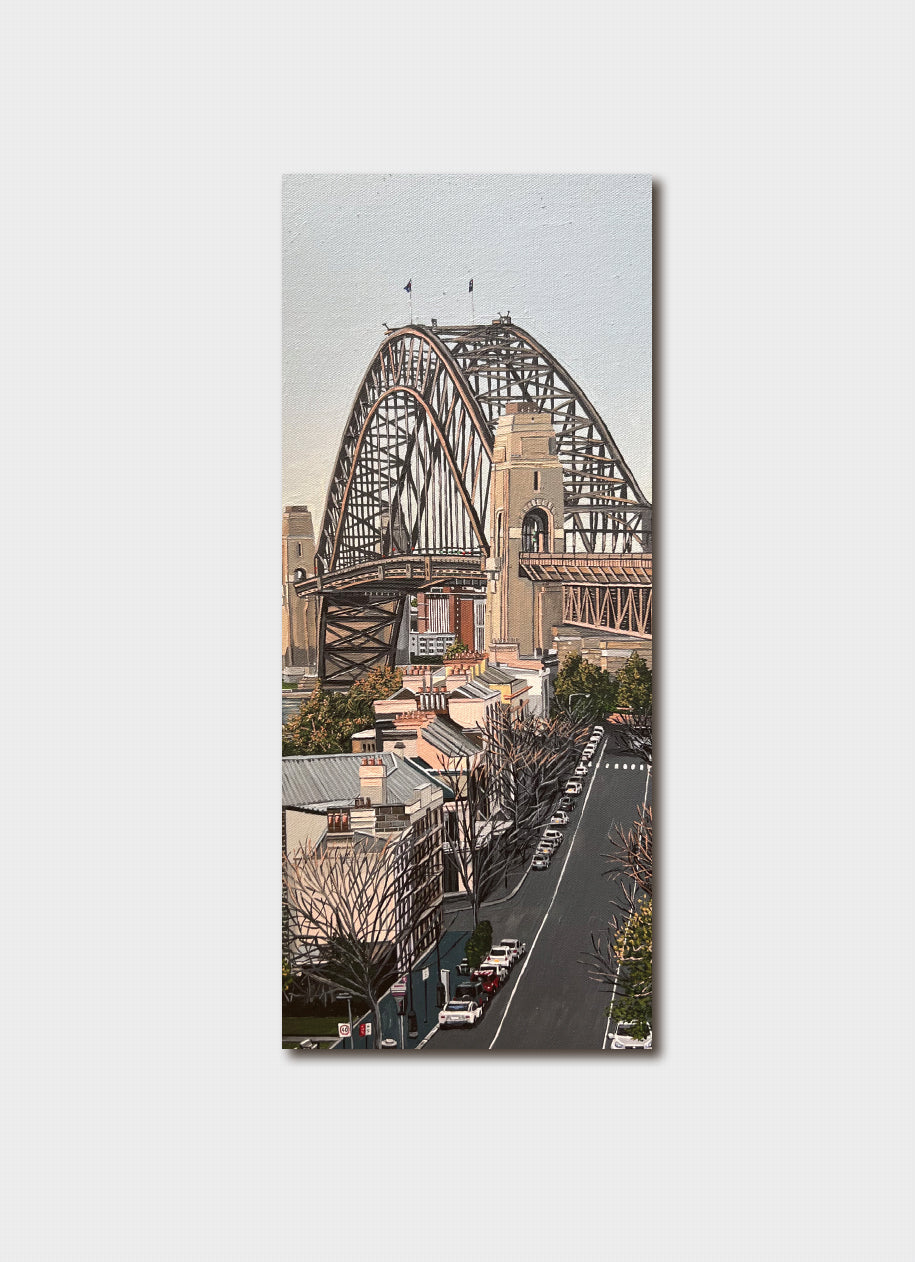 Bookmark with a painting of a road leading up to the Sydney Harbour bridge.