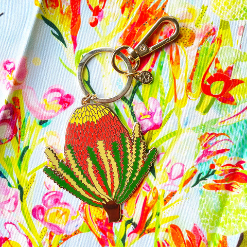 Keychain with a colorful design on a floral background