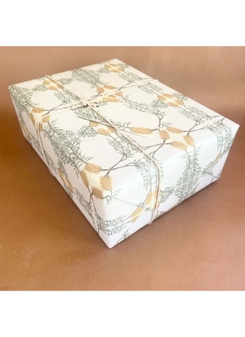 Gift box with decorative paper on a brown surface