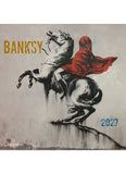 Banksy artwork with a person on a horse, featuring the artist's name and the year 2027.