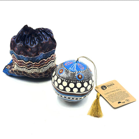 Decorative Christmas ball with tassel and drawstring bag on a white background