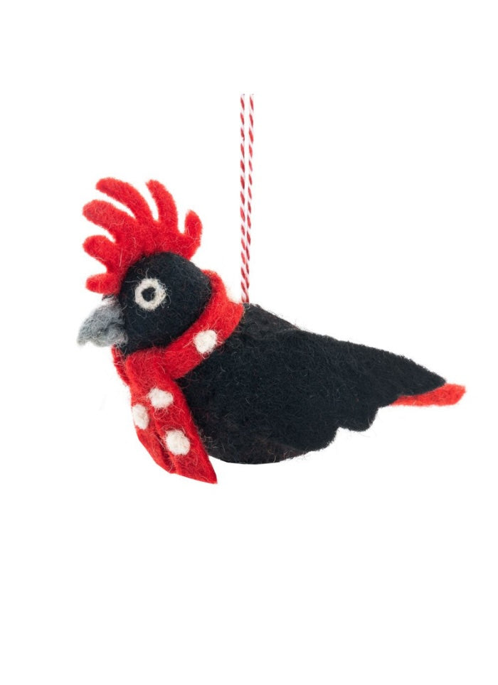 Decorative bird ornament with a red scarf on a white background