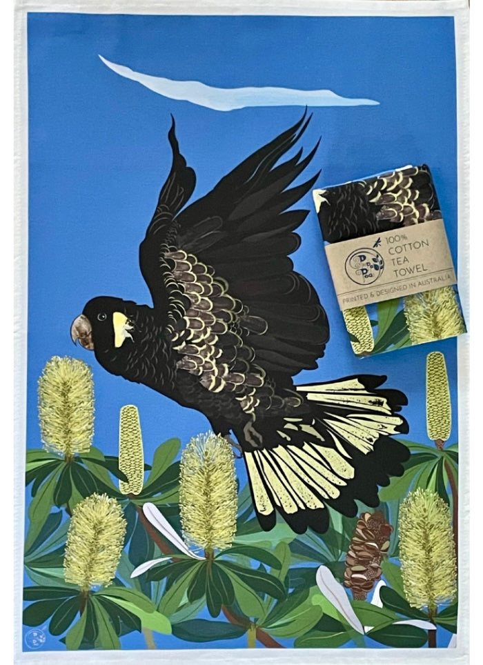 Tea towel with a black and yellow bird design on a blue background