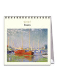 Calendar cover with a painting of boats on a waterway, featuring the year 2027 and the word 'Boats'.