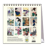 Calendar with Japanese woodblock art featuring women in traditional attire on a white background.