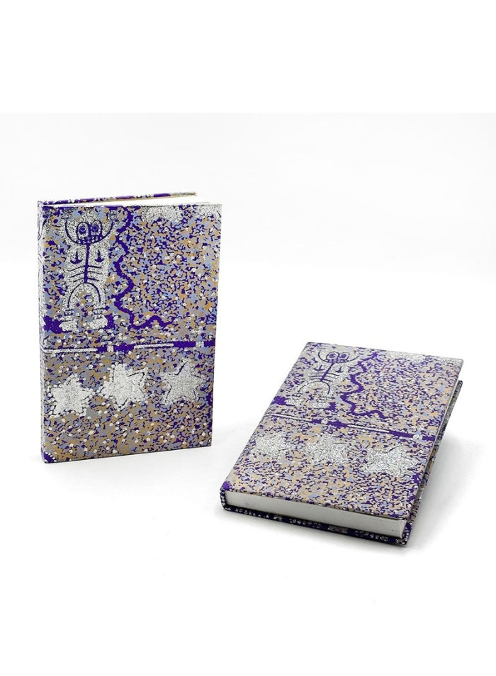 A kraft glitter lined notebook with artwork by Cedric Varcoe.