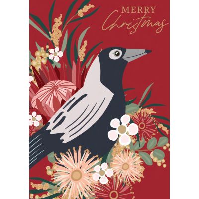 A red card with a black and white bird sitting amongst native flowers and the words Merry Christmas.