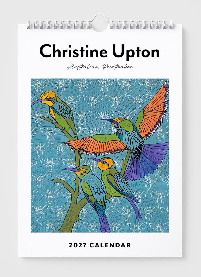 2027 calendar with colorful bird design and 'Christine Upton' text on a white background