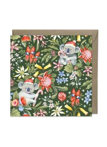 Greeting card with koala illustrations and floral design on a green background