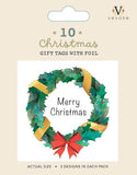 A packet of 10 Christmas gift tags with foil showing a tag with a green wreath with red and gold ribbon and the words merry Christmas.