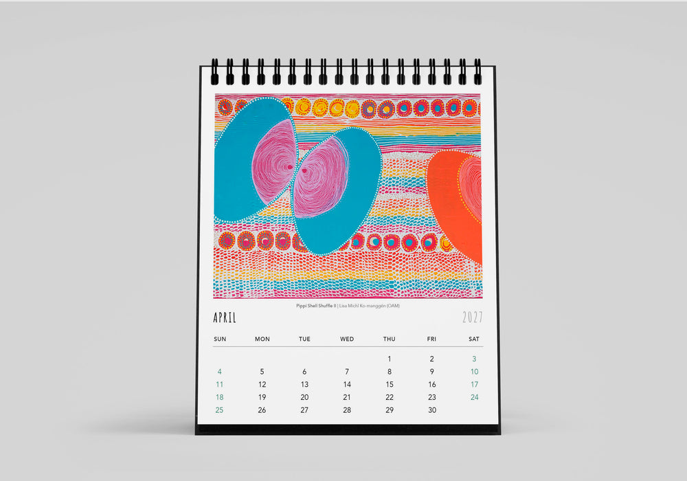 Colourful spiral-bound calendar with abstract design on a gray background