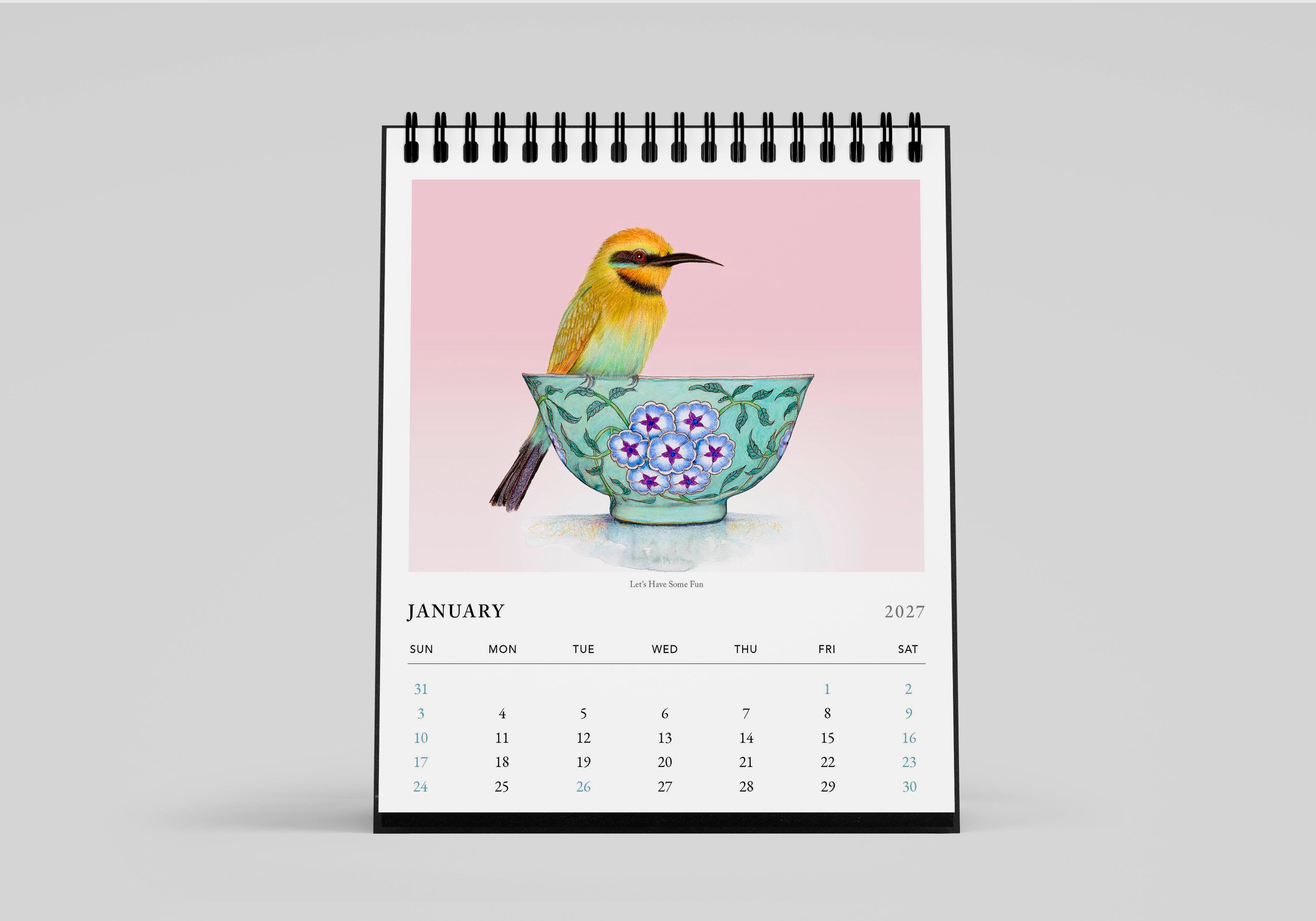 Calendar with a bird and floral design on a pink background