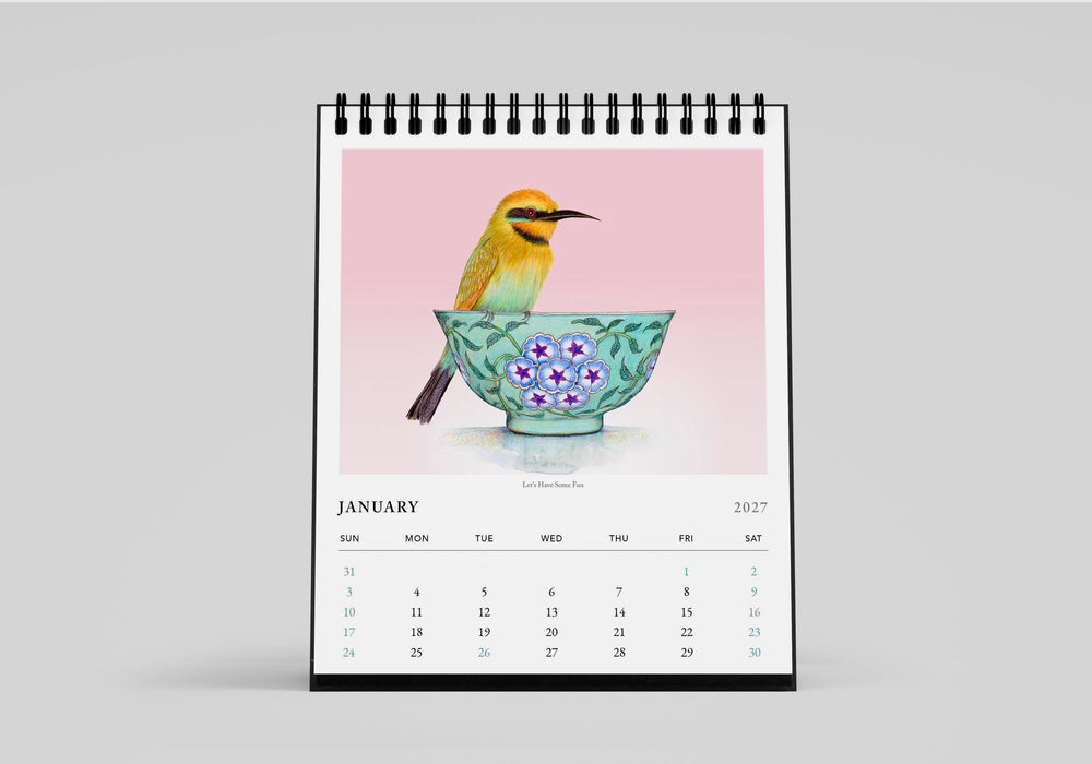 Calendar with a bird and floral design on a pink background