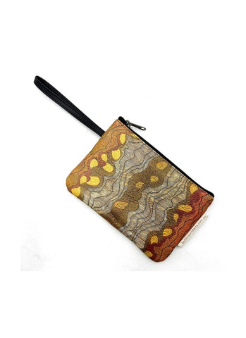 Wristlet clutch with abstract pattern on a white background