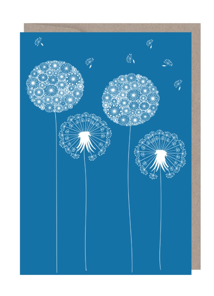A mid blue background with white dandelion flowers