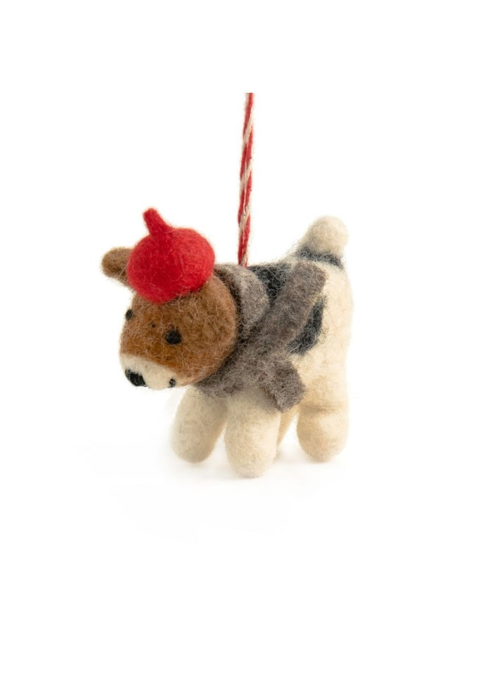 Felted dog ornament with a red hat on a white background