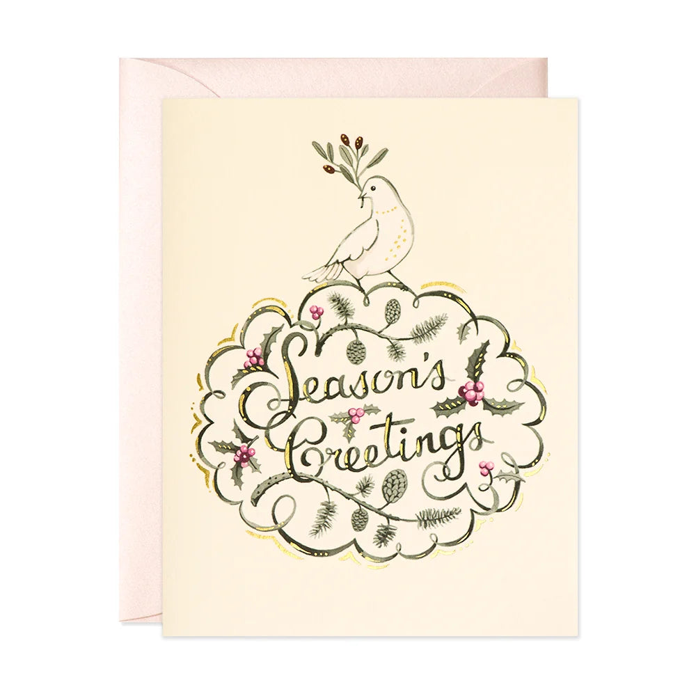 A Christmas card with a Peace Dove with the words Seasons greetings.