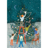 A Christmas tree being decorated by 5 children