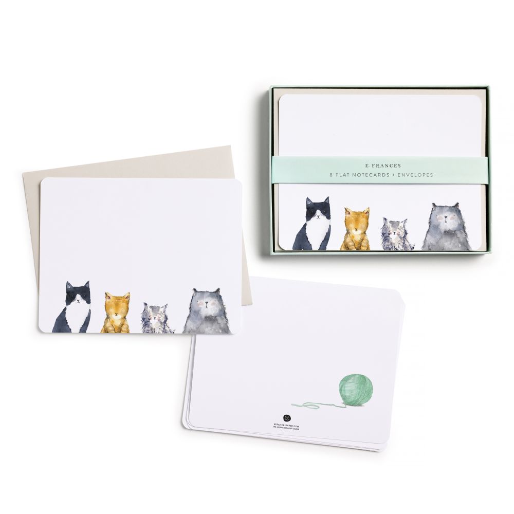Set of cat-themed notecards with envelopes and a box packaging on a white background