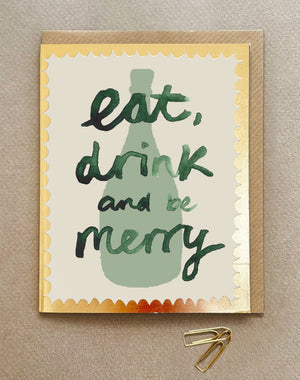 A card with a picture of a wine bottle and the words Eat, Drink and be Merry