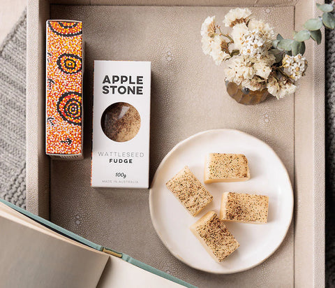 Apple Stone Warrnambool Fudge on a plate with packaging and decorative elements.