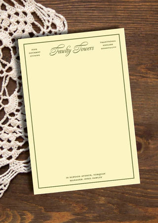 Invitation card on a wooden surface with lace fabric