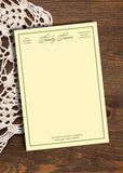 Invitation card on a wooden surface with lace fabric