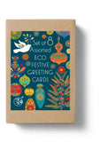 Brown box with a green label with a peace dove and Christmas baubles