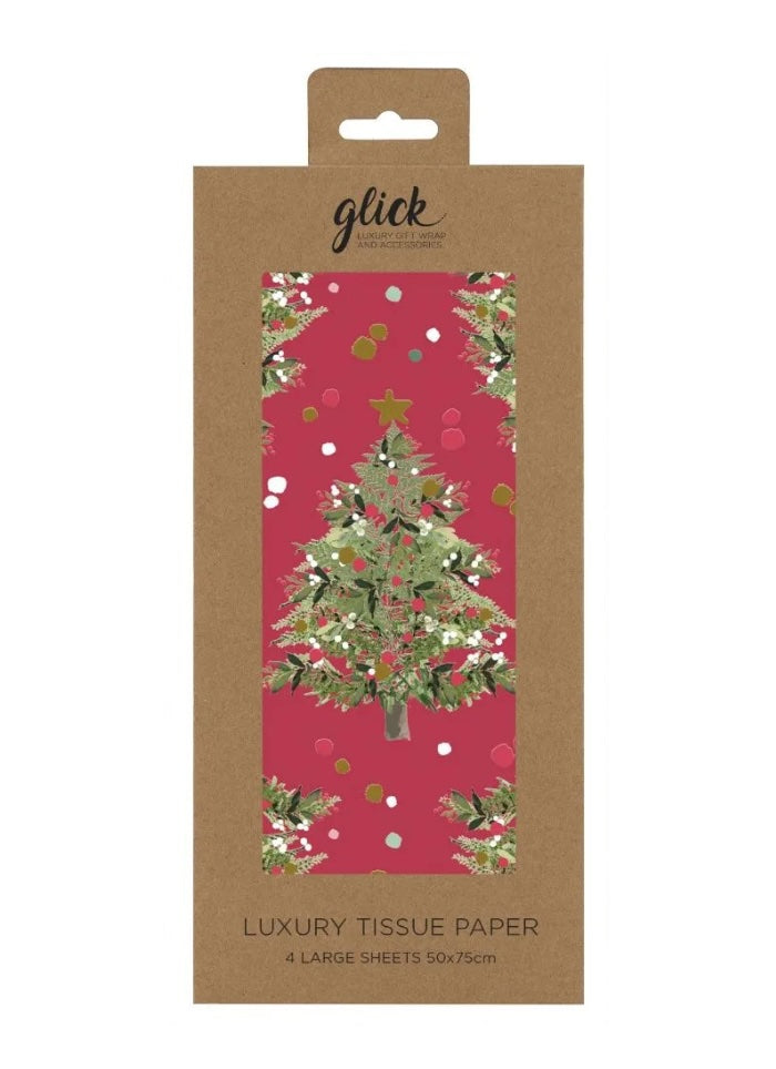 Packaged luxury tissue paper with Christmas tree design on a pink background, featuring the brand 'glick'.