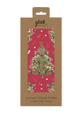 Packaged luxury tissue paper with Christmas tree design on a pink background, featuring the brand 'glick'.
